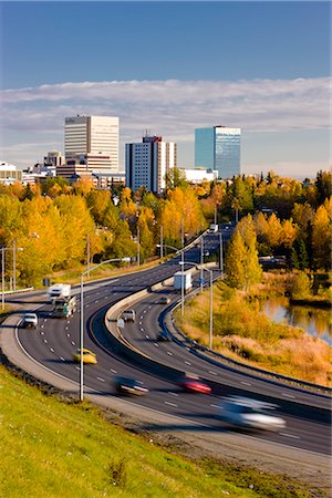 road city panorama - Scenic view of Minnesota Blvd. traffic along Westchester Lagoon on a sunny day with downtown Anchorage in the distance, Southcentral Alaska, Fall Stock Photo - Rights-Managed, Code: 854-03646347