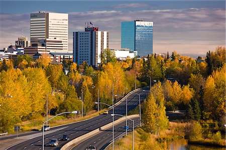 road city panorama - Scenic view of Minnesota Blvd. traffic along Westchester Lagoon on a sunny day with downtown Anchorage in the distance, Southcentral Alaska, Fall Stock Photo - Rights-Managed, Code: 854-03646349