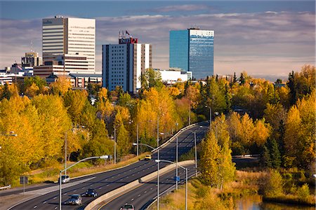 small town snow - Scenic view of Minnesota Blvd. traffic along Westchester Lagoon on a sunny day with downtown Anchorage in the distance, Southcentral Alaska, Fall Stock Photo - Rights-Managed, Code: 854-03646349