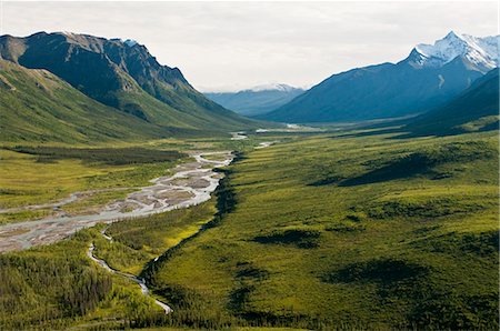 Aerial photo of North Fork Koyukuk River winding away from Frigid Crags and Boreal Mountain, also known as the "Gates of the Arctic," in Gates of the Arctic National Park & Preserve, Arctic Alaska, Summer Stock Photo - Rights-Managed, Code: 854-03646625
