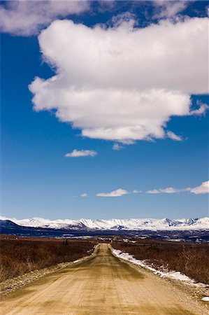 View of the Denali Highway and Alaska Range foothills just before the Susitna River Bridge, Southcentral Alaska, Spring Stock Photo - Rights-Managed, Code: 854-03739973