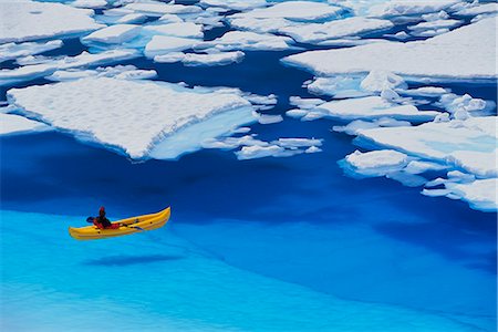 floe - Female kayaker navigates through a melt pond in the Juneau /nIcefield, Coast Mountains, Tongass National Forest, Southeast Alaska, Summer Stock Photo - Rights-Managed, Code: 854-03845109