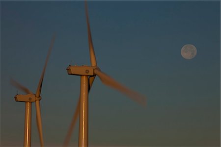 renewable resource - Pillar Mountain Wind Project wind turbines on Pillar Mountain at dawn with a full moon in the background, Kodiak Island, Southwest Alaska, Summer Stock Photo - Rights-Managed, Code: 854-03845207