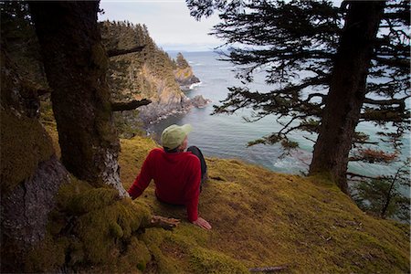 state historic park - Female hiker resting and enjoying the view overlooking Chiniak Bay at Fort Abercrombie State Historical Park on Kodiak Island, Southwest Alaska, Fall Stock Photo - Rights-Managed, Code: 854-03845247