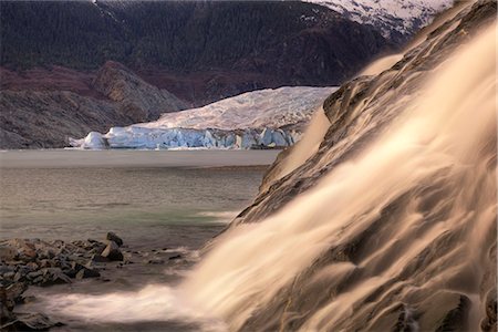 Scenic view of Nugget Falls with Mendenhall Glacier in the background near Juneau, Southeast Alaska, Spring Stock Photo - Rights-Managed, Code: 854-03845871