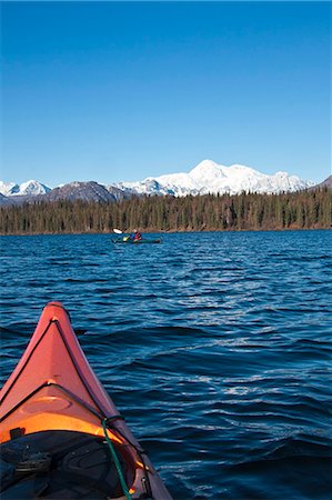 Woman kayaking in Byers Lake as seen from another kayaker's point of view with scenic view of Mt. McKinley on a clear sunny day, Denali State Park, Southcentral Alaska, Autumn Stock Photo - Rights-Managed, Code: 854-03845985