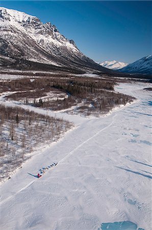 simsearch:854-03846022,k - Aerial view of a dog team musing on the North Fork of the Koyukuk River in Gates of the Arctic National Park & Preserve with Frigid Crags in the background, Arctic Alaska, Winter Stock Photo - Rights-Managed, Code: 854-03846016