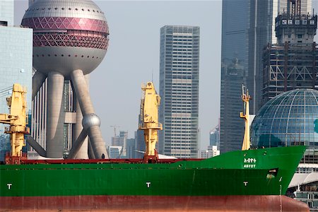 A cargo tanker passes by the Pudong skyline, Shanghai, China Stock Photo - Rights-Managed, Code: 855-05981430