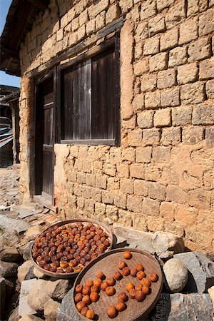simsearch:855-05981752,k - Drying persimmons at courtyard of Tulou Shizelou, Gaobei village, Yongding, Fujian, China Stock Photo - Rights-Managed, Code: 855-05981795
