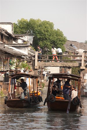 Tourist boats on canal at old town of Wuzhen, Zhejiang, China Stock Photo - Rights-Managed, Code: 855-05982695