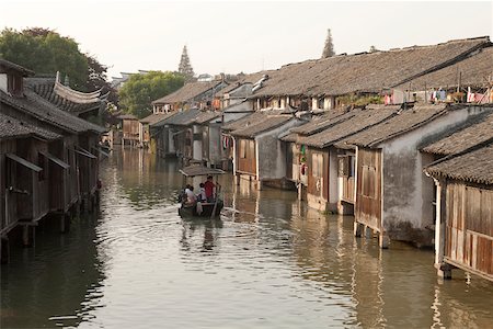 Tourist boat on canal at old town of Wuzhen, Zhejiang, China Stock Photo - Rights-Managed, Code: 855-05982701