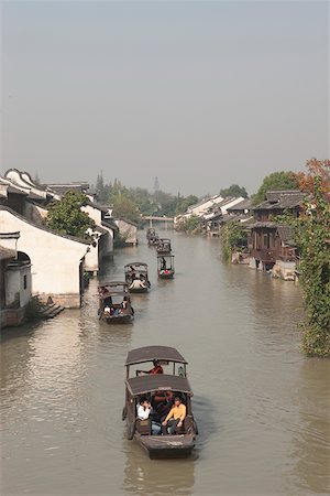 Tourist boats on canal at old town of Wuzhen, Zhejiang, China Stock Photo - Rights-Managed, Code: 855-05982740