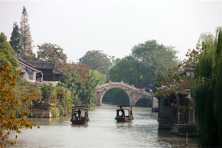 Tourist boats on canal, old town of Wuzhen, Zhejiang, China Stock Photo - Rights-Managed, Code: 855-05982771