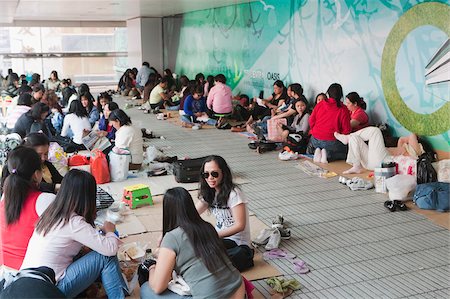 simsearch:855-02987217,k - Filipinas gather on the footbridge at Connaught Road Central on Sunday, Hong Kong Stock Photo - Rights-Managed, Code: 855-05983262