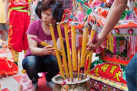 simsearch:855-06313357,k - Worshippers offering incense at the Tin Hau temple during the Tin Hau festival, Joss House Bay, Hong Kong Stock Photo - Rights-Managed, Code: 855-06022488