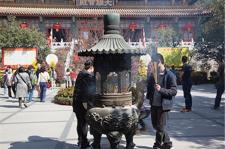 simsearch:855-06313356,k - Worshipper offering at Po Lin Monastery, Lantau Island, Hong Kong Stock Photo - Rights-Managed, Code: 855-06313583