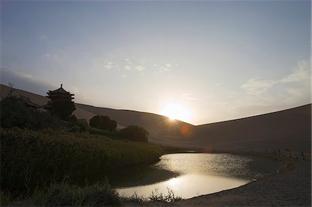 Sunset over Yueyaquan (Crescent moon lake), Mingsha Shan, Dunhuang, Silkroad, Gansu Province, China Stock Photo - Rights-Managed, Code: 855-06337766