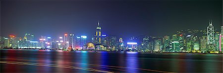 panorama - Spectacular Hong Kong skyline with trails of boats in Victoria Harbour, Hong Kong Stock Photo - Rights-Managed, Code: 855-06339399