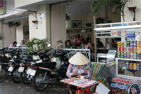 simsearch:855-03021954,k - A lottery ticket vendor by the pho restaurant where former US president Bill Clinton visited twice during his visit to Ho Chi Minh City,Vietnam Stock Photo - Rights-Managed, Code: 855-03022143