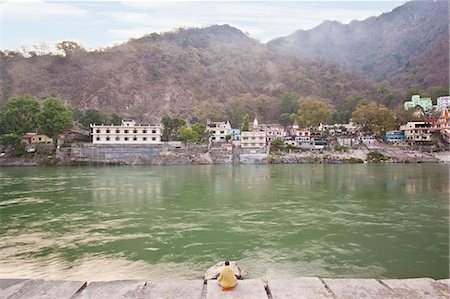 Man meditating at the riverside, River Ganges, Rishikesh, Dehradun District, Uttarakhand, India Stock Photo - Rights-Managed, Code: 857-06721513