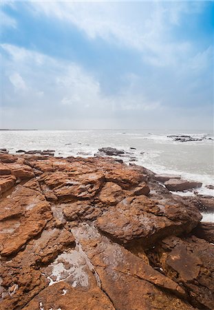 Rock formations at the coast, Dwarka Beach, Dwarka, Gujarat, India Stock Photo - Rights-Managed, Code: 857-06721694