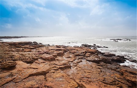 Rock formations at the coast, Dwarka Beach, Dwarka, Gujarat, India Stock Photo - Rights-Managed, Code: 857-06721692