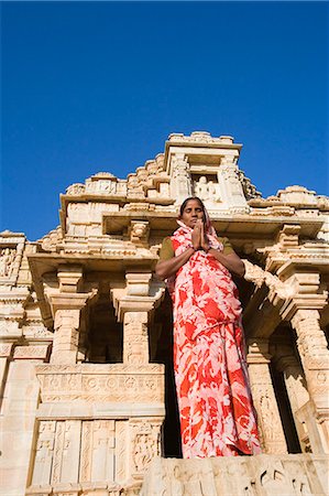simsearch:857-03193051,k - Woman standing in a prayer position in front of a temple, Kumbha Shyam Temple, Chittorgarh, Rajasthan, India Stock Photo - Rights-Managed, Code: 857-03192477