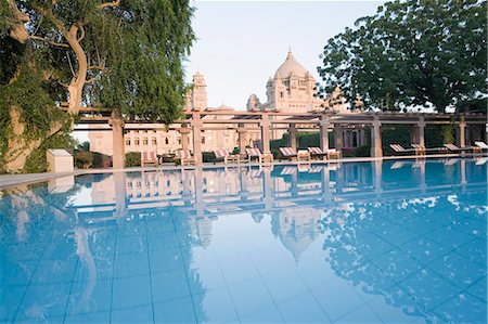 Reflection of a palace in a swimming pool, Umaid Bhawan Palace, Jodhpur, Rajasthan, India Stock Photo - Rights-Managed, Code: 857-03192587