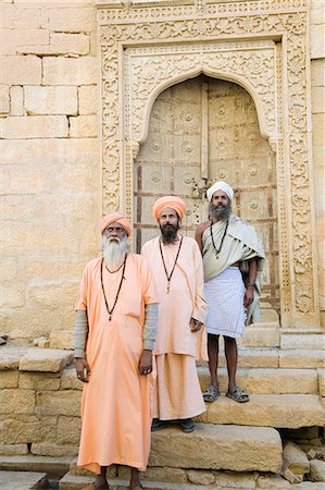 Three sadhus standing in front of a building, Jaisalmer, Rajasthan, India Stock Photo - Rights-Managed, Code: 857-03192612