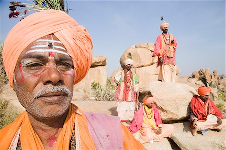 Close-up of a sadhu with four sadhus in the background, Hampi, Karnataka, India Stock Photo - Rights-Managed, Code: 857-03192786