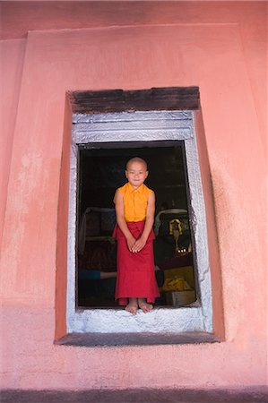 Monk standing at the entrance of a temple, Mahabodhi Temple, Bodhgaya, Gaya, Bihar, India Stock Photo - Rights-Managed, Code: 857-03192917