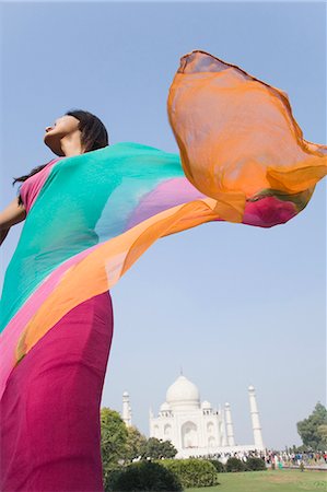 Woman standing in front of a mausoleum, Taj Mahal, Agra, Uttar Pradesh, India Stock Photo - Rights-Managed, Code: 857-03193072