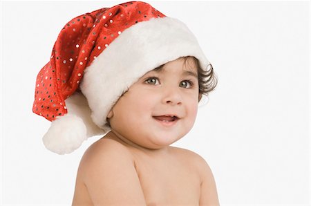 Close-up of a baby boy wearing a Santa hat Stock Photo - Rights-Managed, Code: 857-03554316