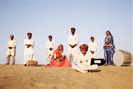 Folk artists performing in a desert, Thar Desert, Jaisalmer, Rajasthan, India Stock Photo - Rights-Managed, Code: 857-03553600