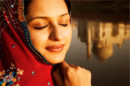 Woman with reflection of mausoleum in the river, Taj Mahal, Yamuna River, Uttar Pradesh, India Stock Photo - Rights-Managed, Code: 857-03553677