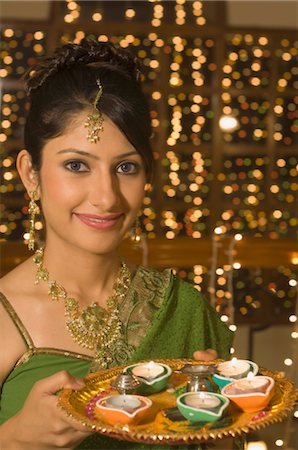 Woman holding a traditional Diwali thali Stock Photo - Rights-Managed, Code: 857-03553804