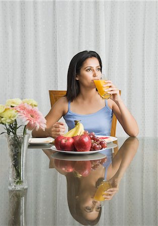 Woman having breakfast, Gurgaon, Haryana, India Stock Photo - Rights-Managed, Code: 857-03553840