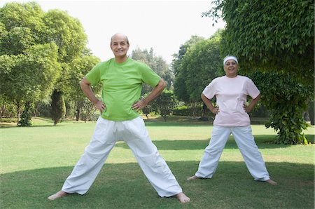 simsearch:6105-05397157,k - Couple practicing yoga in a park, New Delhi, India Stock Photo - Rights-Managed, Code: 857-03553870