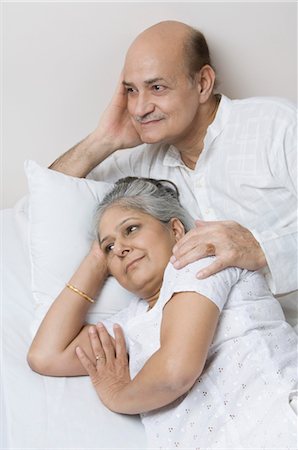 Couple lying on the bed and day dreaming Stock Photo - Rights-Managed, Code: 857-03553871