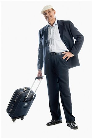 Man carrying his luggage and smiling Stock Photo - Rights-Managed, Code: 857-03553887