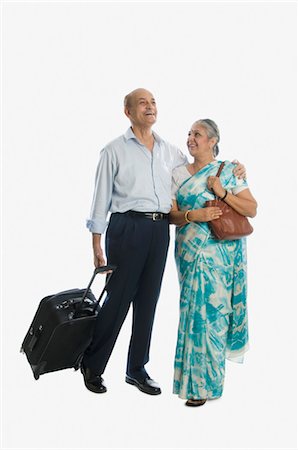 Couple smiling with their luggage Stock Photo - Rights-Managed, Code: 857-03553880