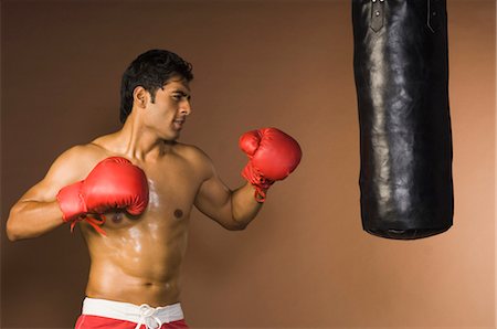 simsearch:400-03984387,k - Man practicing boxing Stock Photo - Rights-Managed, Code: 857-03553921