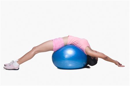 Young woman exercising on a fitness ball Stock Photo - Rights-Managed, Code: 857-03553962
