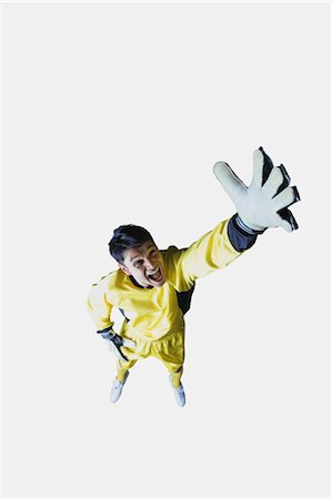 diving (not water) - Studio Shot of a Young Male Goal Keeper Stock Photo - Rights-Managed, Code: 858-05604608