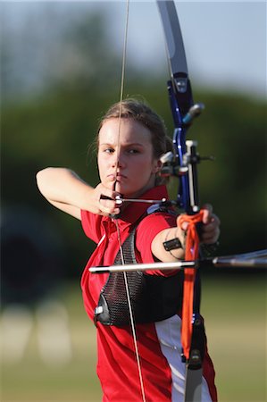 precise - Young Female Archer Aiming at Target Stock Photo - Rights-Managed, Code: 858-05604893