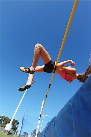 simsearch:858-05604961,k - Jeune athlète féminine effectuant le saut en hauteur Photographie de stock - Rights-Managed, Code: 858-05604967