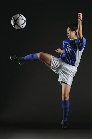 female playing soccer - Japanese Woman Hitting Football Stock Photo - Rights-Managed, Code: 858-06118962