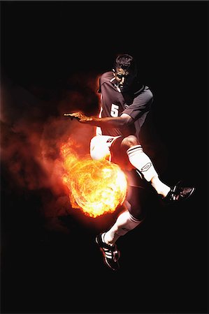 simsearch:614-07239995,k - Soccer Player Kicking Flaming Soccer Ball Stock Photo - Rights-Managed, Code: 858-06159386