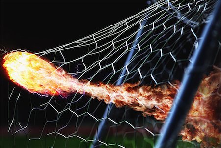 simsearch:614-07239995,k - Flaming Soccer Ball In Goal Net Stock Photo - Rights-Managed, Code: 858-06159387