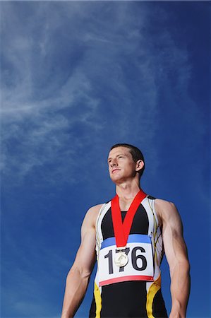 simsearch:858-06617630,k - Male Athlete Wearing a Silver Medal Stock Photo - Rights-Managed, Code: 858-06617625